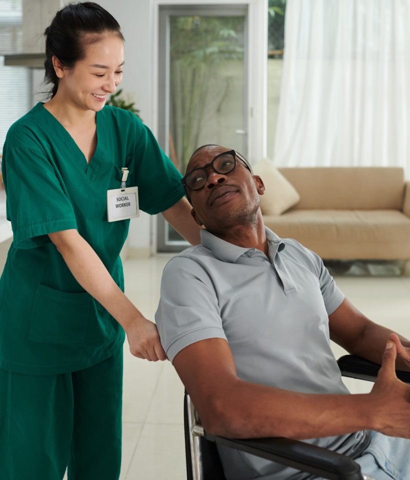 pushing-wheelchair-of-sick-patient-2025-01-29-08-36-19-utc